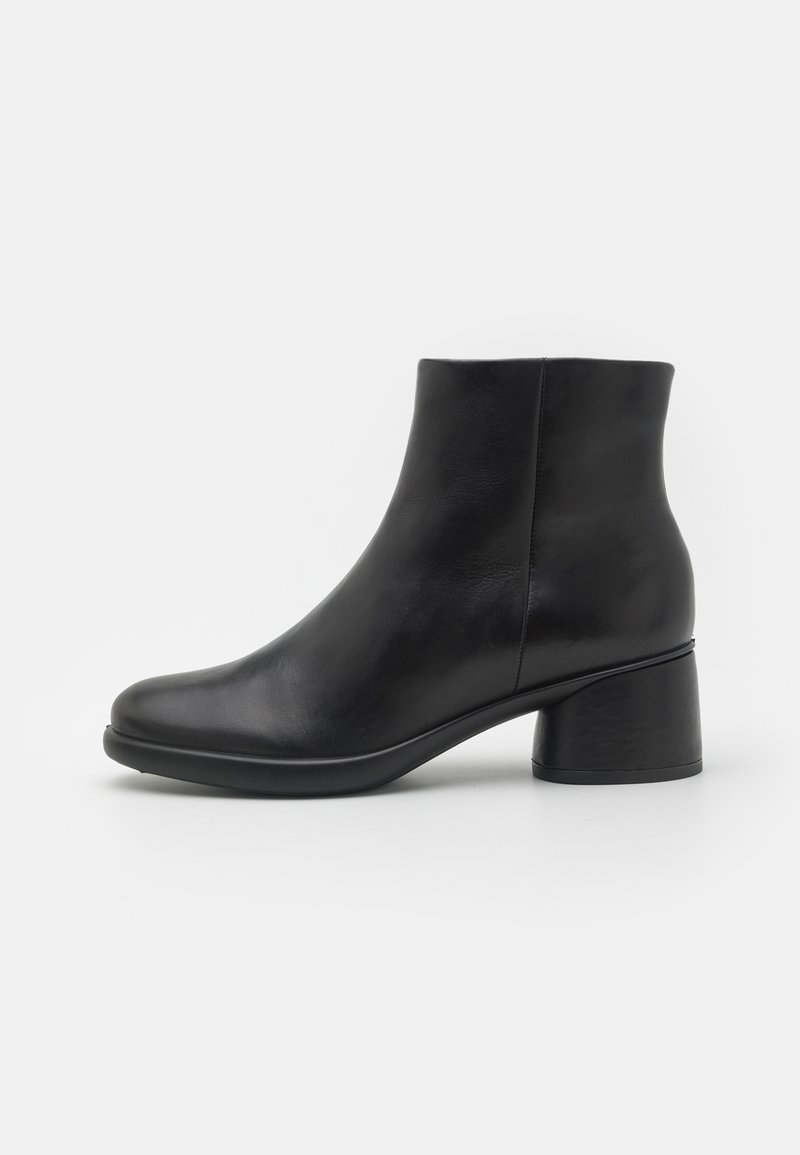 Black leather ankle boots with a rounded toe and a modest, chunky heel. The design features a smooth texture and minimalist style.