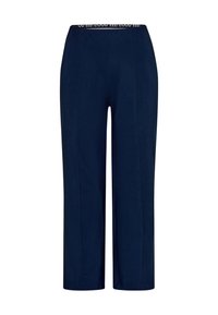 Tmavě modré kalhoty rovného střihu s elastickým pasem a bílými logy. Vyrobeno z měkké látky s hladkým povrchem.