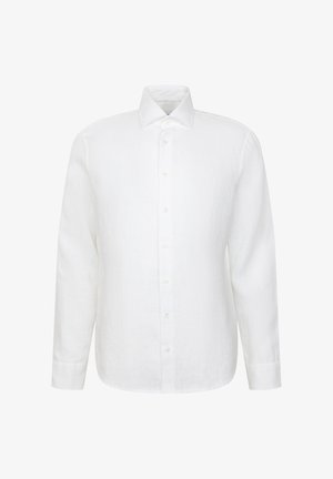 Chemise blanche à manches longues avec col pointu, devant uni et poignets standards, présentée sur un fond blanc.