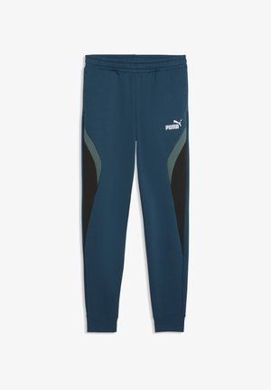 Marineblå Puma joggingbukser med elastisk talje, sorte og grå sidepaneler og Puma-logo på øverste venstre lår.