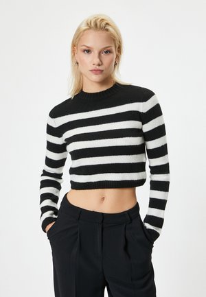 Mustavalkoraidallinen lyhyt villapaita, jossa on pyöreä kaula-aukko ja pitkät hihat. Valmistettu pehmeästä materiaalista, jossa on slim fit -malli ja ribbireuna.