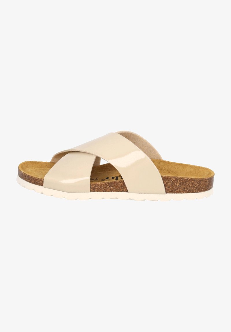 Sandale à glissière beige avec finition brillante, semelle intérieure en liège et semelle extérieure en caoutchouc blanc. Design plat, style à bout ouvert avec texture douce.