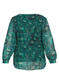 Blouse à manches longues en tissu transparent avec motif de plumes de paon vertes et bleu sarcelle, manches resserrées aux poignets, vue de dos.