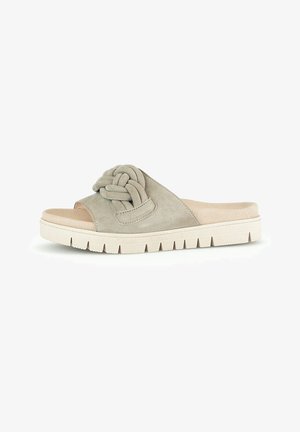 Suede slide sandal in light gray, featuring a knotted strap and a textured white sole with ridges. Open toe and slip-on design.