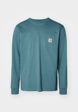 Pikae varrukatega teal värvi T-särk, mis on valmistatud puuvillast. Omab ümarat kaelust, sirget lõppuserva ning rinna peal on tasku logo plaadiga.