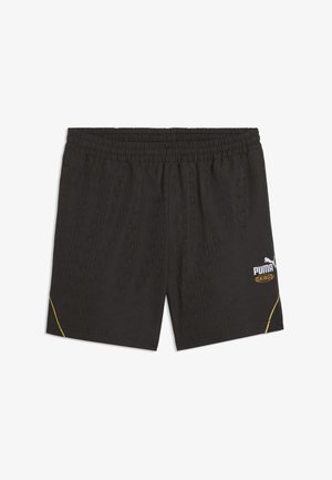 Shorts de sport Puma noirs avec taille élastique, motif embossé subtil, petit logo Puma King blanc et or sur la jambe droite, et accents dorés sur les ourlets.