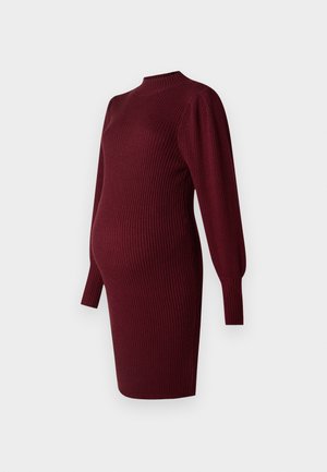 Abito premaman in maglia a coste color bordeaux con maniche lunghe e volume, dotato di un collo alto, progettato per adattarsi al pancione.