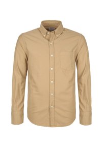 Lange mouw patachshirt in lichtbruin katoen. Heeft een klassieke kraag, een enkele borstzak en witte knopen. Glad textuur.