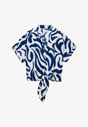 Kratki rukavi, skraćena košulja od bijelog materijala s plavim uzorkom valova, s ovratnikom i čvorastim detaljem sprijeda. Gumbi na prednjoj strani.