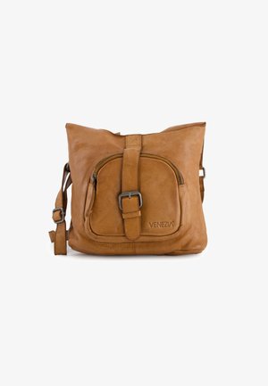 Tan leather crossbody bag with a textured surface, featuring a front zipper pocket, adjustable strap, and embossed logo.