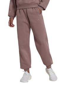 Sweatpants in mauve katoenmix, met een relaxte pasvorm, elastische tailleband en ribgebreide manchetten. Versierd met een tonale logo op de dij.