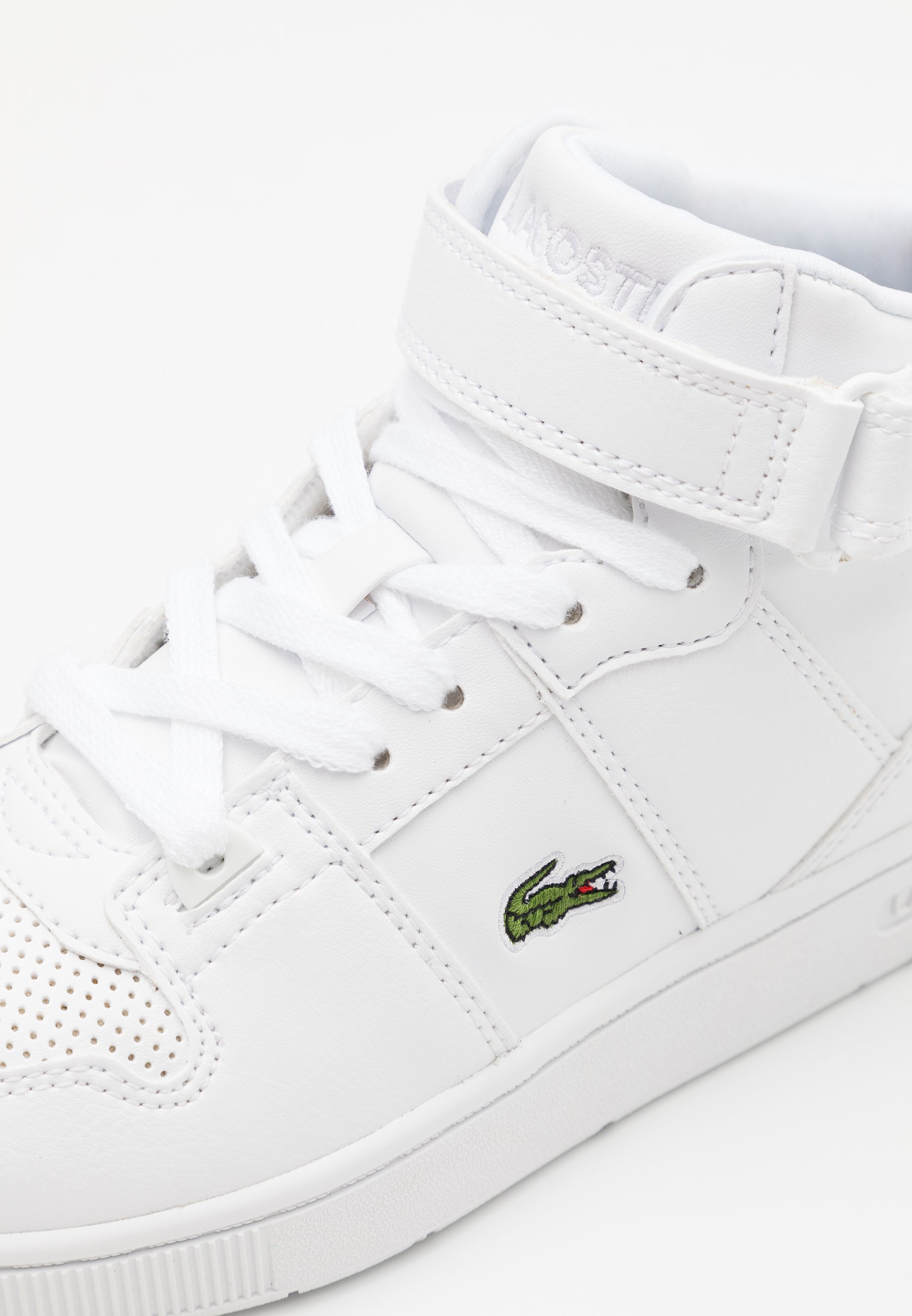 lacoste mid trainers