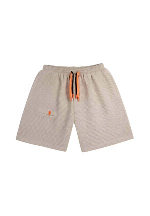 Short beige texturé avec taille élastique, cordons noirs et orange, et petite poche boutonnée sur le côté gauche.