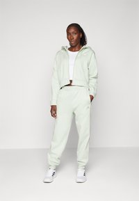 adidas Sportswear ENERGIZE - Tracksuit - linen green