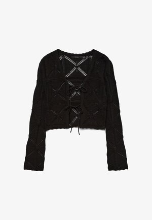 Μαύρη μακρυμάνικη ζακέτα πλεκτή με κυματιστά άκρα, γεωμετρικά σχέδια και δύο δεσίματα μπροστά.