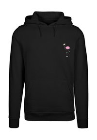 Felpa nera con tasca a marsupio e grafica di un fenicottero rosa sul lato sinistro del petto. Realizzata in un tessuto morbido e strutturato. Cappuccio regolabile.