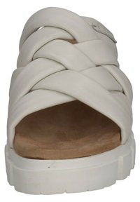 White braided sandal with a wide strap and open toe design. Textured upper and a thick white platform sole with a natural suede footbed.