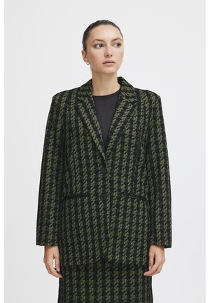Černý a zelený houndstooth blazer s dvěma knoflíky, klopovým límcem a předními kapsami. Texturovaná tkanina, střih přizpůsobený postavě.
