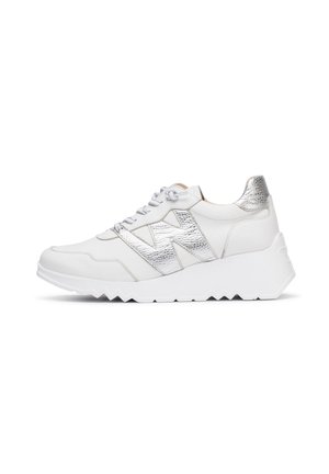 White leather sneaker with a silver textured logo design on the side. Features a thick white zigzag sole and grey shoelaces.