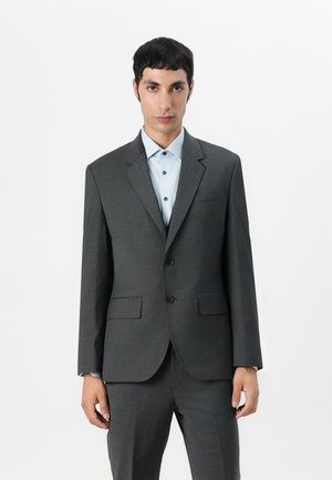 Gray suit jacket with notch lapels, two buttons, and front pockets. Worn over a light blue shirt with matching buttons. Tailored fit.