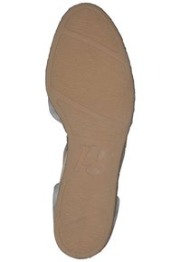 Semelle de chaussure en caoutchouc brun texturé ; les contours et rainures améliorent l'adhérence ; comprend le logo "pg" embossé sur le caoutchouc.