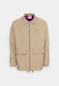 adidas Originals Tunn jacka - olive