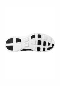 Semelle de chaussure de sport en noir et blanc présentant un design en caoutchouc texturé avec des motifs de semelle rectangulaires et hexagonaux pour une adhérence et un soutien.