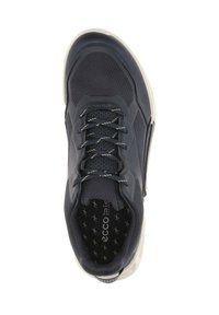 Navy blue athletic shoe with a textured fabric upper, white laces, and rubber outsole. Features padded collar and logo on the insole.