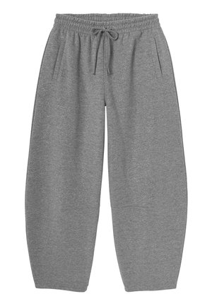 Pantalons de survêtement gris, surdimensionnés, avec une taille élastique et un cordon de serrage, dotés de poches latérales et d'un tissu doux et texturé.