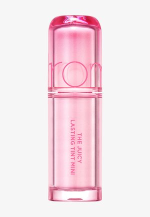Lille lyserød gennemsigtig læbetinttube mærket "The Juicy Lasting Tint Mini" med en stjerne prydet på låget.