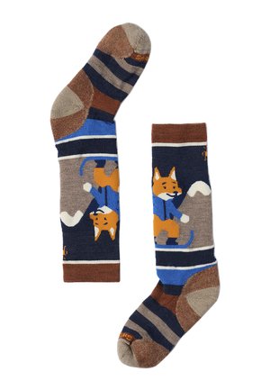 Par de calcetines hasta la rodilla con rayas marrones, beige y azul marino y un zorro con chaqueta azul esquiando como diseño principal.