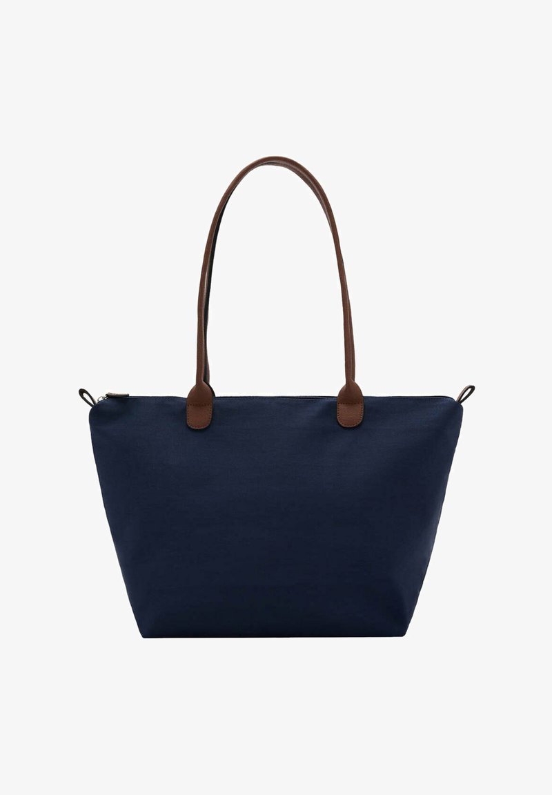 Grand sac cabas bleu marine avec une large base et des bretelles en cuir marron, avec une fermeture éclair en haut et des boucles latérales.