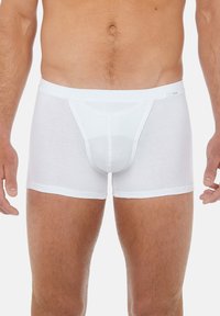 White cotton boxer briefs with a fitted design, slightly ribbed texture, and a seamless waistband, featuring a front pouch for support.