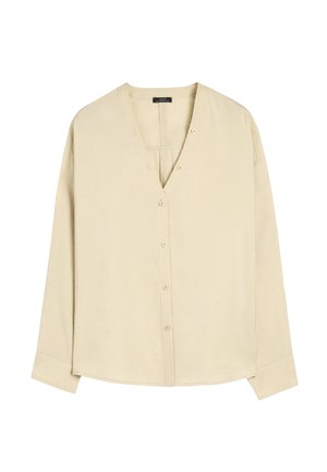 Jasnobeżowa koszula z długim rękawem, z dekoltem w serek, z pięcioma guzikami z przodu i luźnym krojem. Miękka tkanina o subtelnej teksturze.
