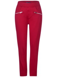 Rode stretchbroek met een aansluitend ontwerp, voorzien van twee ritszakken aan de voorkant en een brede tailleband voor comfort.