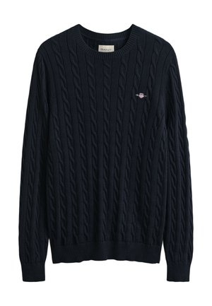 Pull en maille torsadée bleu marine avec encolure et ourlet côtelés, présentant un petit logo sur la poitrine. Fabriqué dans un matériau texturé et doux.