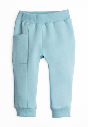 Jasnoniebieskie spodnie dresowe dla malucha z prążkowanym pasem i mankietami, z pojedynczą naszywaną kieszenią na lewej nogawce.