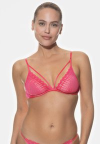 Rosa spets-bustier med geometriska mönster, tunna band och bygelstöd. Har scalloperade kanter och justerbara axelband.