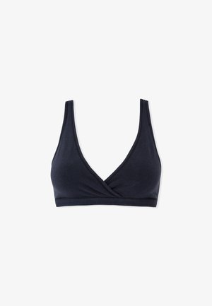 Soutien-gorge noir sans coutures avec bonnets souples, larges bretelles et décolleté croisé en V profond sur fond blanc.