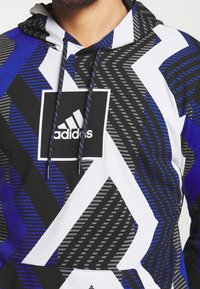 adidas Performance Jersey con capucha - white