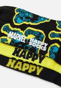 Black socks with bright blue and yellow graphic patterns featuring comic elements, labeled "MARVEL Happy Socks" in bold white text.