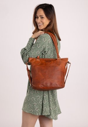 Brown leather tote bag with dual handles, rectangular shape, smooth texture, and a detachable shoulder strap. Top opening with minimal hardware.