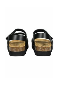 Sandales en cuir noir avec deux larges sangles, une semelle en liège et une semelle en caoutchouc texturé noir. Présente un design minimaliste et une finition lisse.
