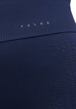 Navy blue athletic leggings featuring a ribbed texture, printed pattern, and the logo "FALKE" in a gray tone near the waistband.