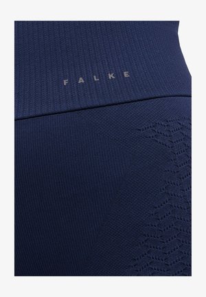 Granatowe legginsy sportowe z fakturą prążkowaną, z nadrukowanym wzorem oraz szarym logo "FALKE" blisko pasa.