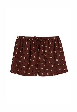 Shorts courts marron avec une taille élastique et un cordon de serrage. Présentent un imprimé léopard avec des taches noires et beiges sur le tissu.