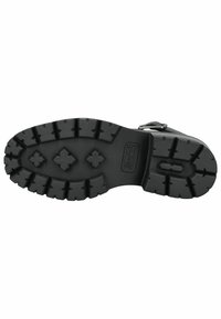 Suela de bota de goma negra con un patrón de tracción resistente que presenta formas de diamante y cruz para mayor agarre y durabilidad.