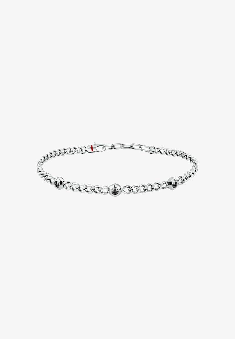 Bracciale in argento con elementi rotondi neri alternati, maglie eleganti e una chiusura sicura, che presenta una superficie metallica lucida.