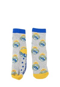 Szare bawełniane skarpetki z niebieskimi ściągaczami i żółtymi akcentami. Posiadają powtarzający się wzór logo Real Madrid w kolorze niebieskim i żółtym na całej powierzchni.