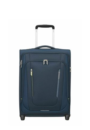 Valise souple bleu marine avec poignée télescopique, poches avant zippées, deux roues, et marque American Tourister sur fond blanc.